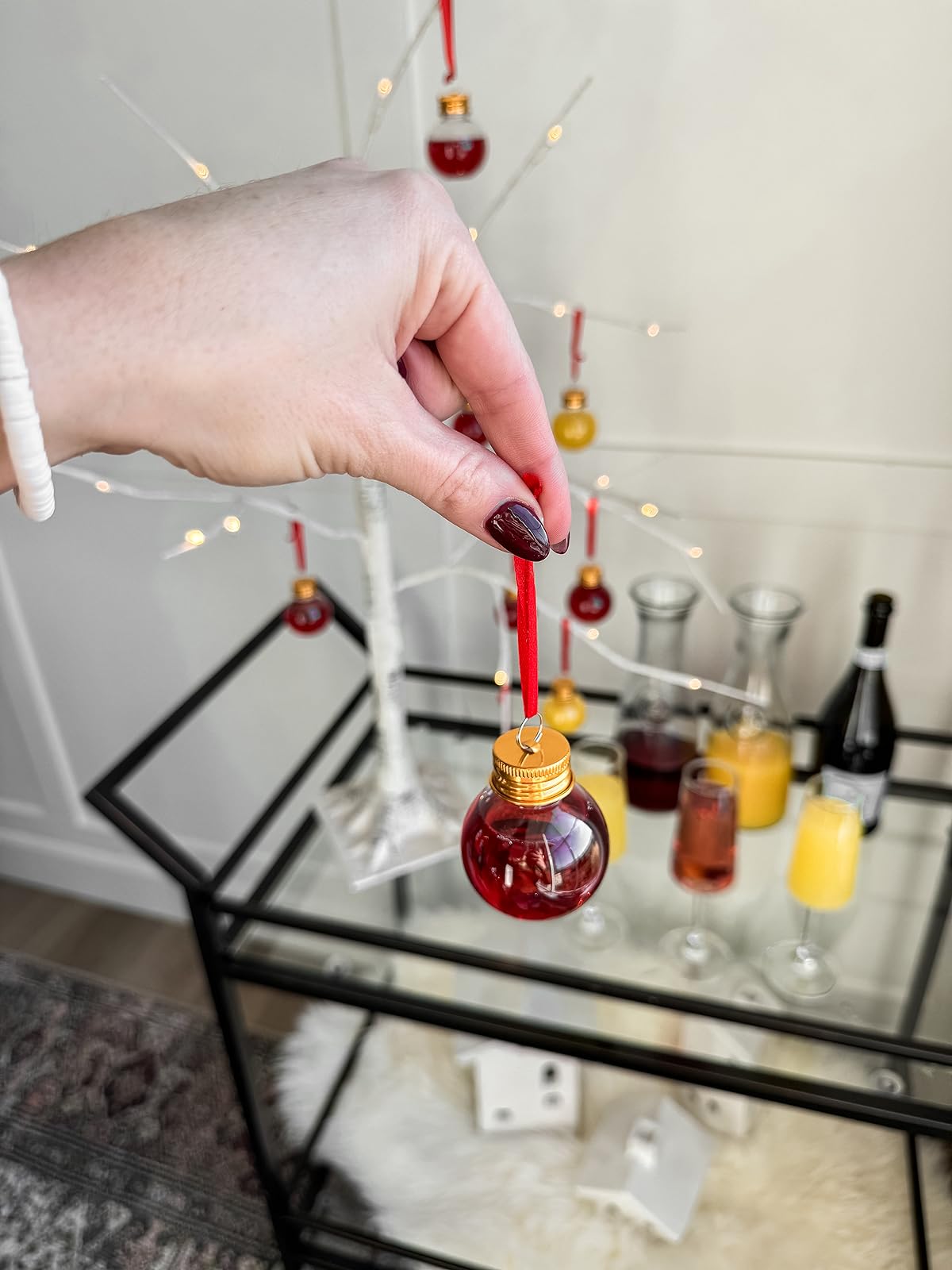 holiday hosting essentials | #holiday #holidayhost #holidayhostessentials #holidayparty #christmasparty #christmas #DIY #lighting #outdoors #barcart #mimosa #ornaments #juice #bartender 