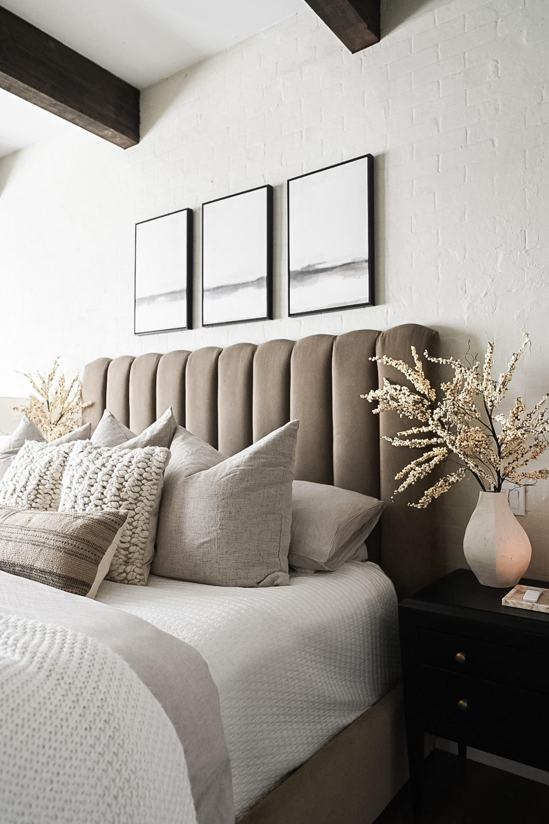 Jordyn's Latest Bedroom Refresh | Bedroom, bedroom makeover, bedroom refresh, room refresh, wall art, bed frame, throw pillows, vase, faux florals, bedside table 