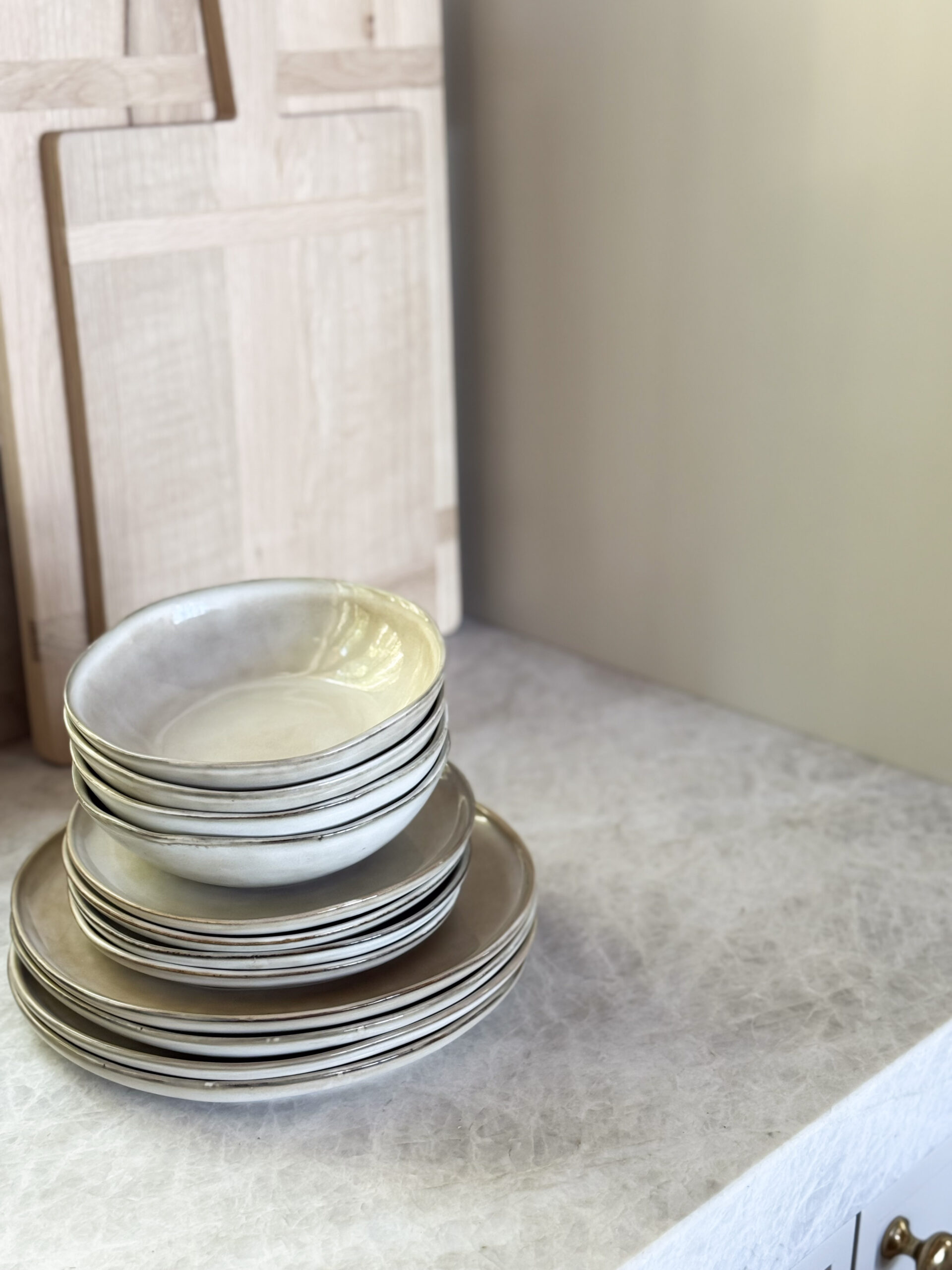 cabin decor essentials | a photo featuring Amazon dinnerware set and wooden bread boards from McGee & Co
