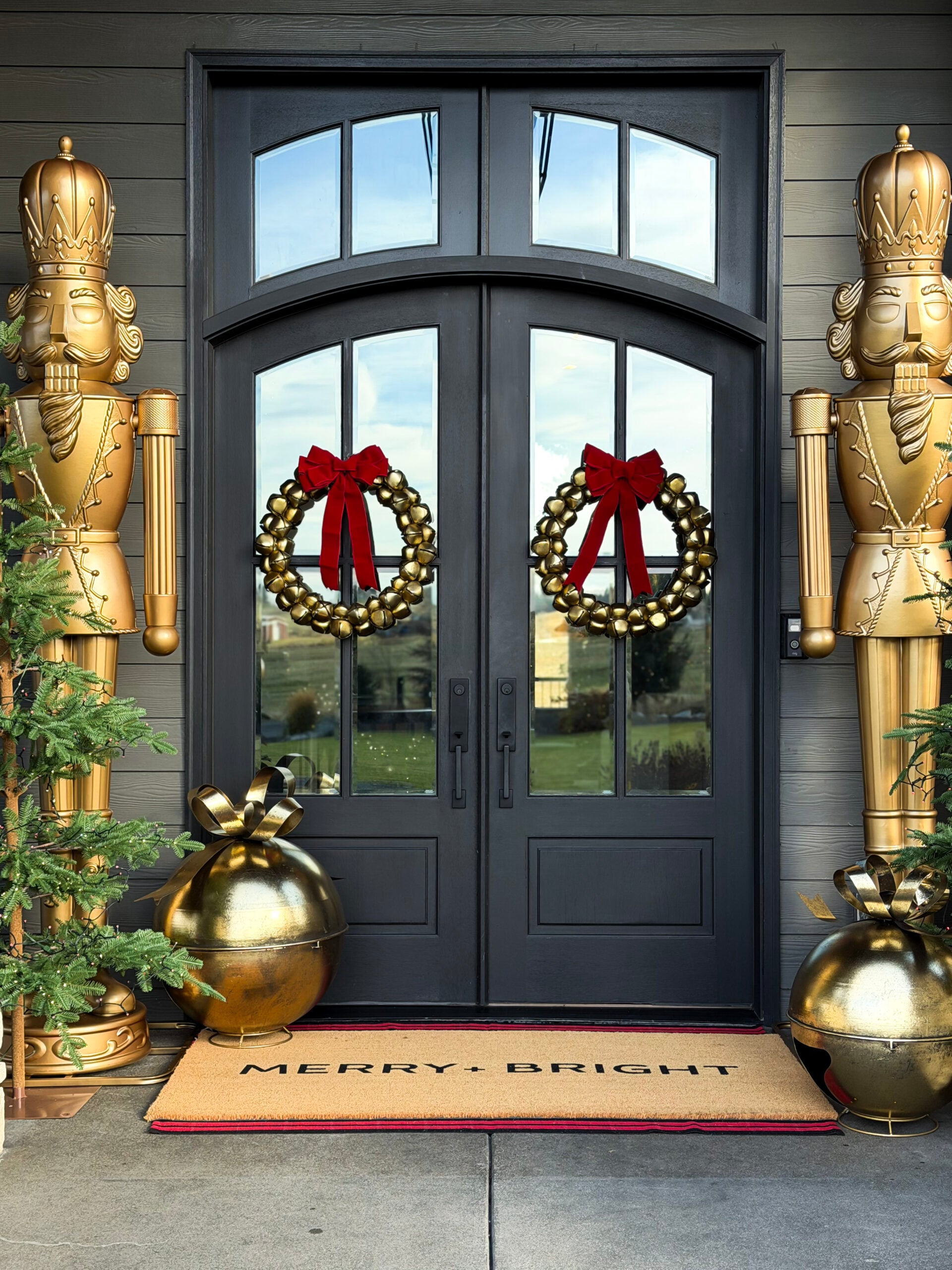 no regret holiday decor | holiday front porch, nutcracker, gold nutcracker, bell wreath, red bow