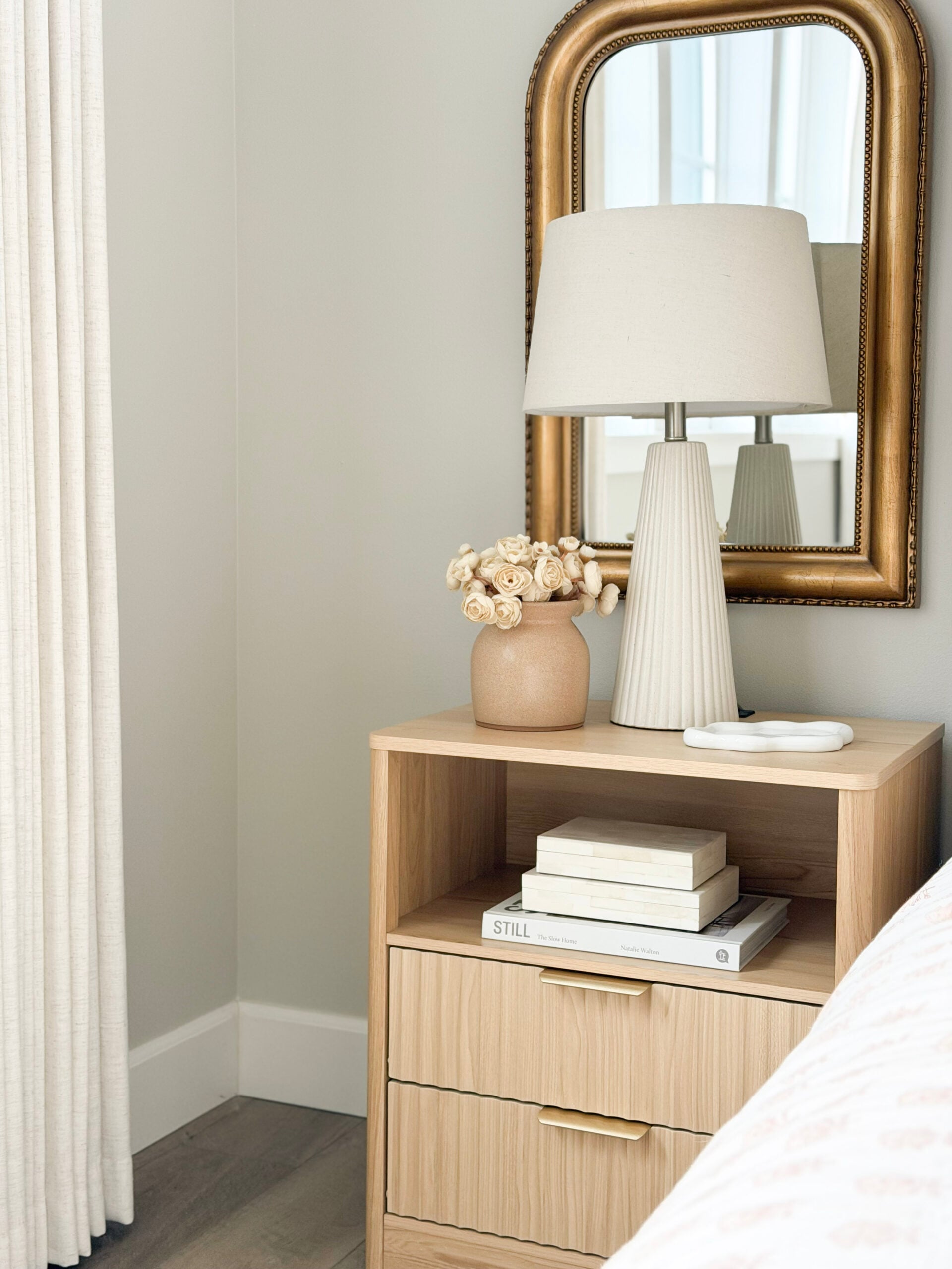 nightstand with neutral decor