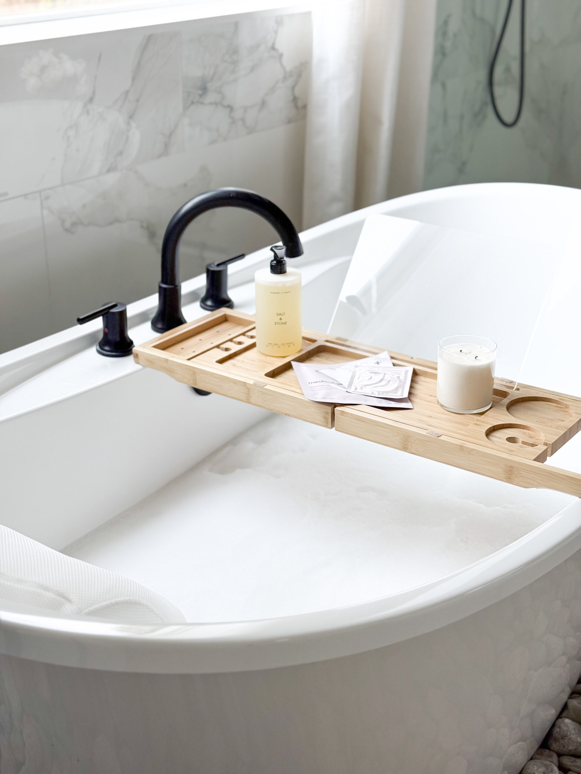 bathtub caddy sitting on tub