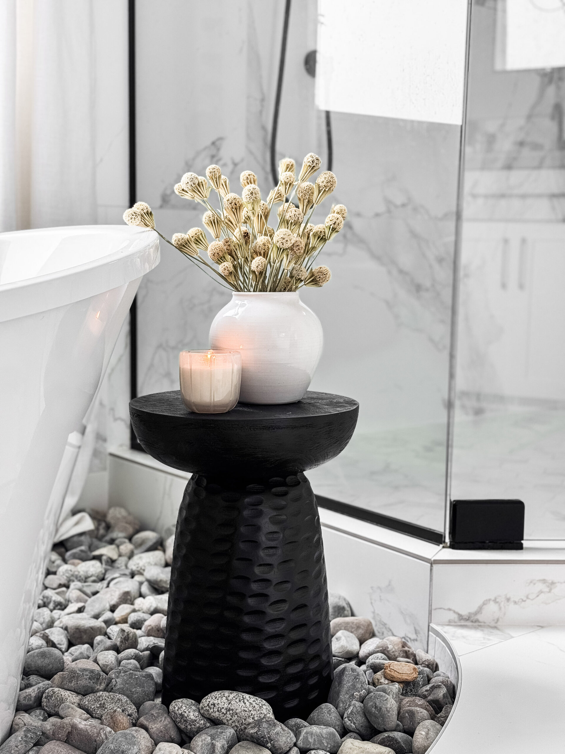 table with candle and flowers in vase