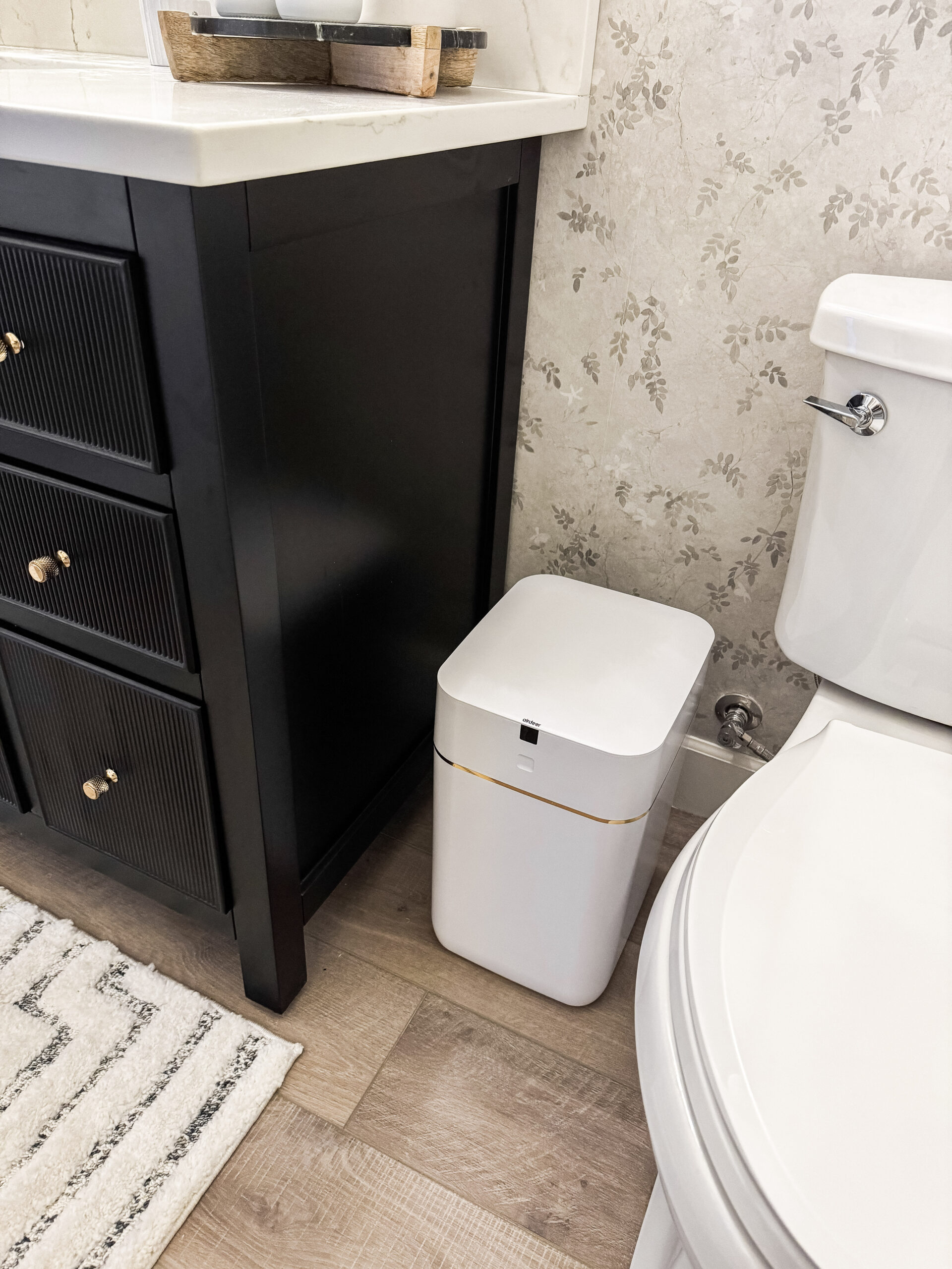 automatic trash can in bathroom