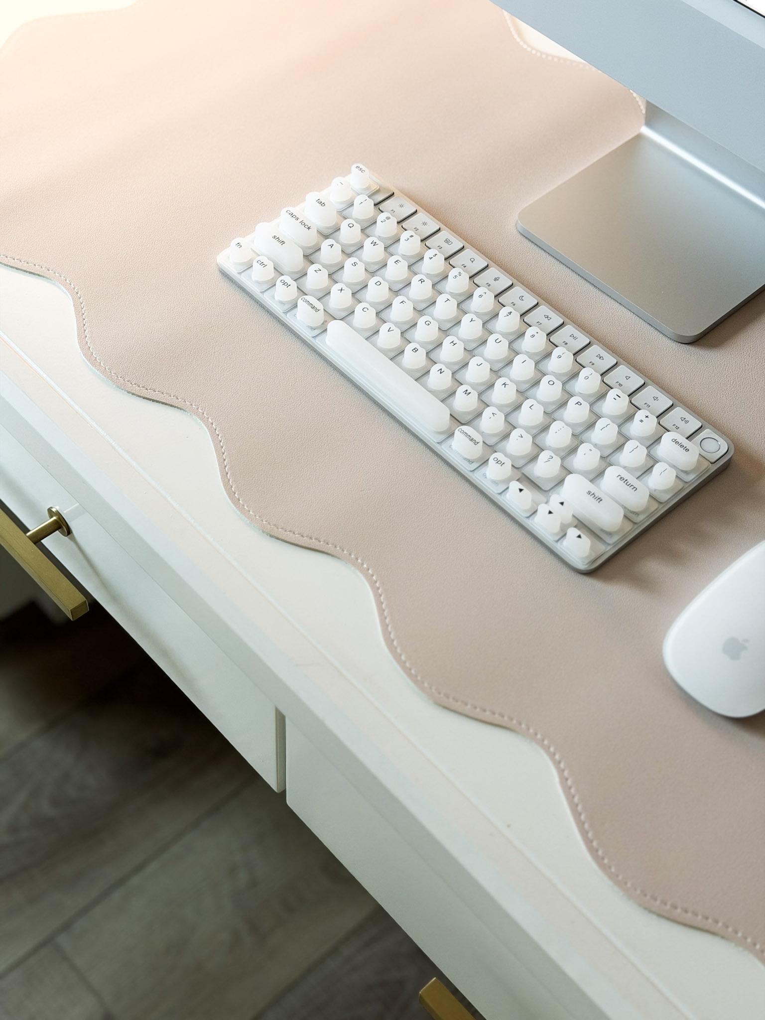 keyboard on scalloped desk mat