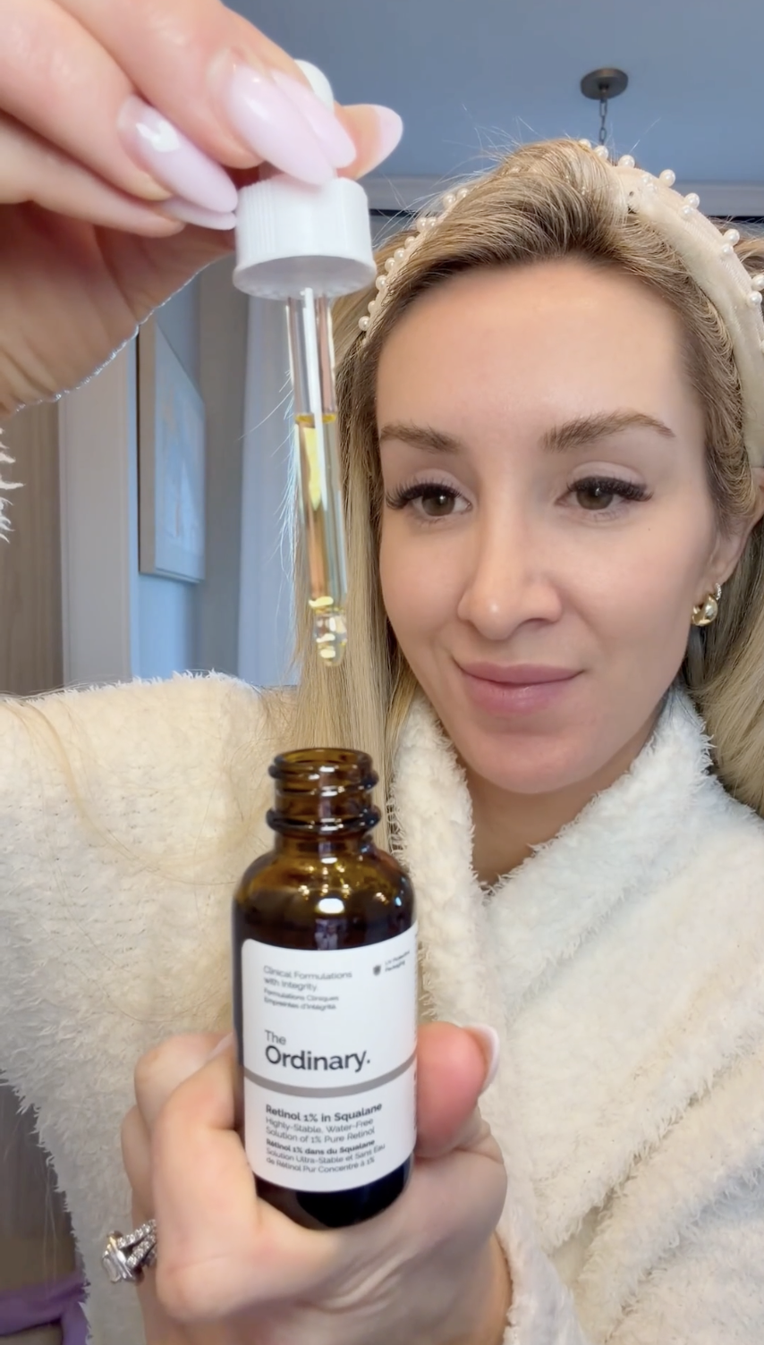 woman with retinol skin oil