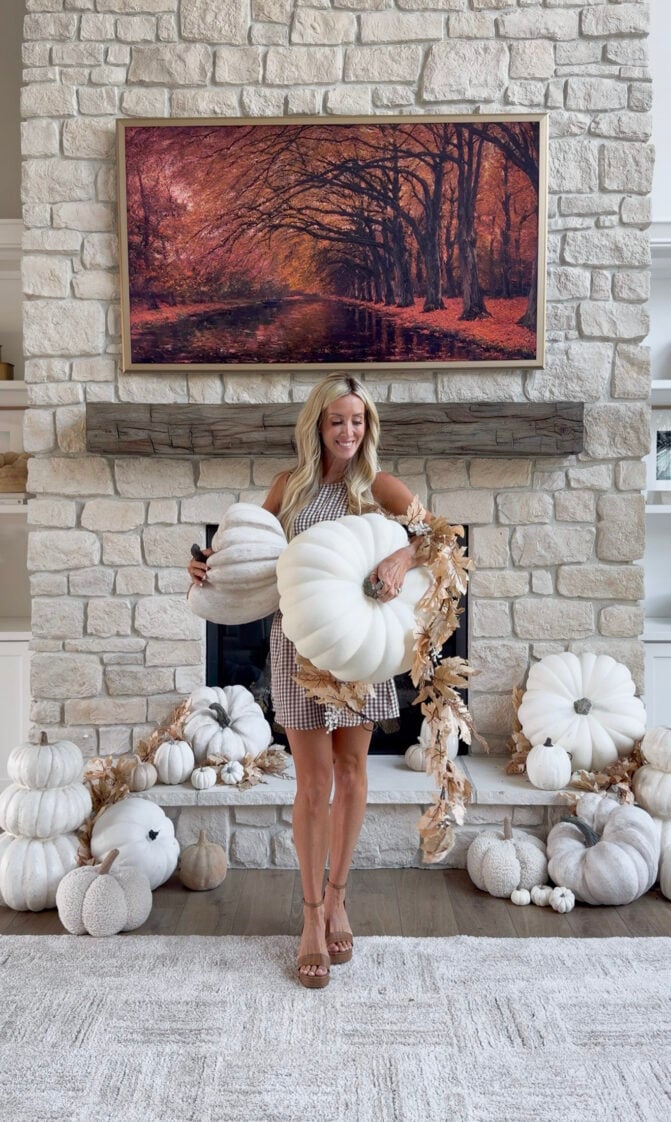 woman standing in front of fall mantle