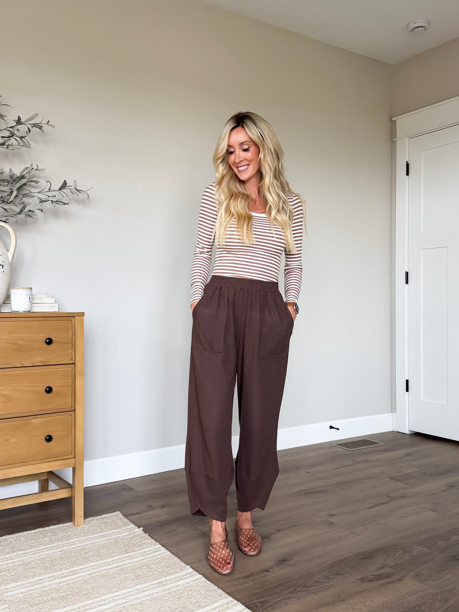 woman wearing wide leg barrel pants